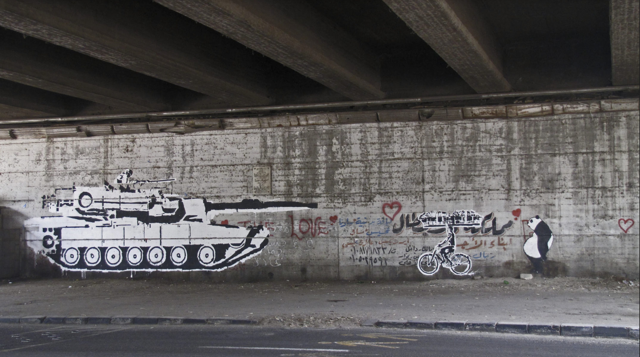 Ganzeer, Tank Vs. Bread Biker, 2011. Acrylic paint on wall.