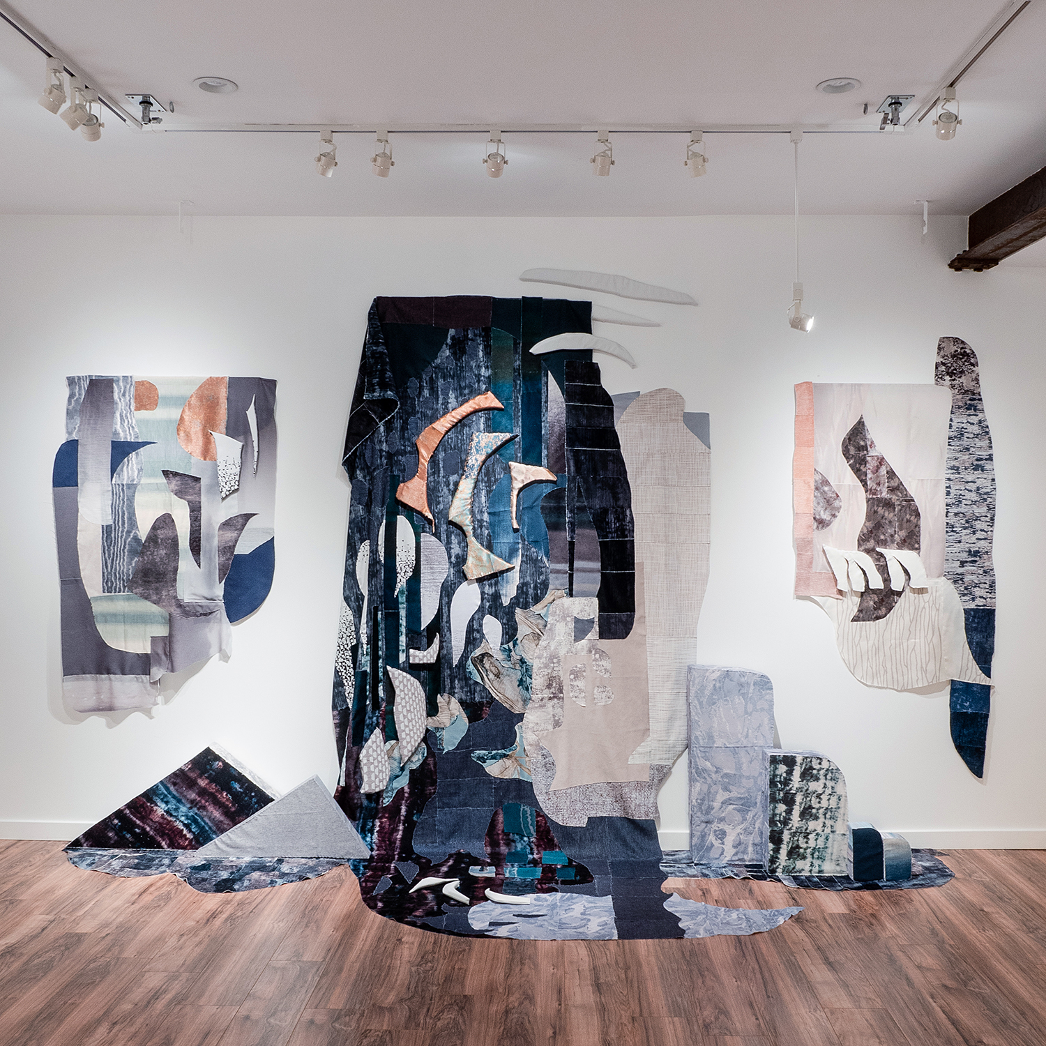 7 Worlds, 2020, Three-dimensional applique with reclaimed fabric and upcycled foam inserts, Dimensions variable (pictured: 16 x 9 x 4 ft)