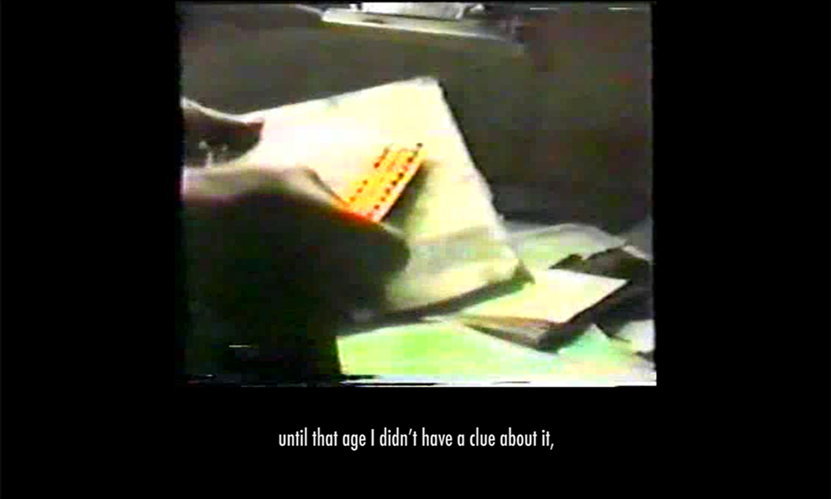 Paper Puppet Testimony (still), 2019, Single-Channel Archival Color VHS- HD video, 8 minutes and 17 seconds 