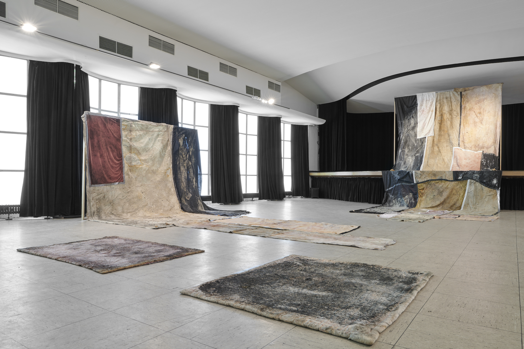Red in Tooth, 2020, 2021, 2022, discarded fabric, ash, rainwater, soil, installation, Dimensions Variable