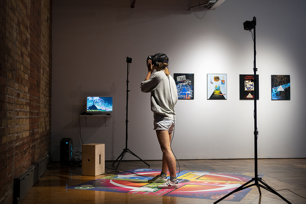 Zaameen.com, Installation Documentation, 2019, four 16 x 20 in works on paper and vinyl, 7 x 7 ft vinyl, Oculus headset and trackers, and computer system