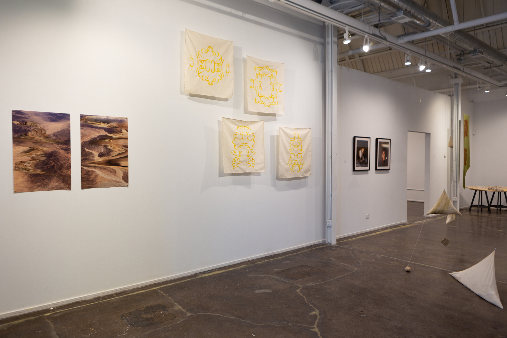 (Left of image): Lithostatic #1 and #2 (2022), Photography, 20 x 30 in
(Right of image): Muthanayat: Mirrored folds of the same self (2022), Saffron, rosewater, fabric, 30 x 30 in