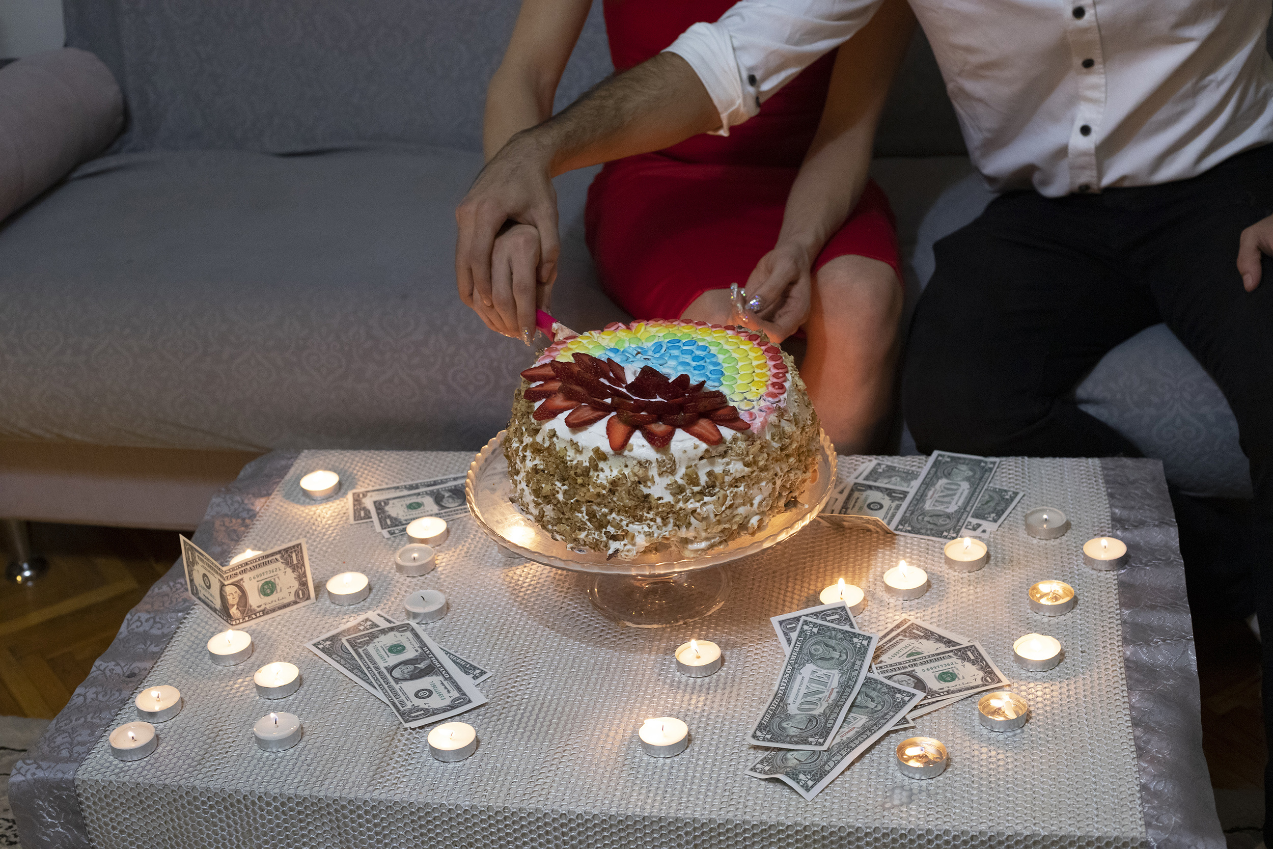Untitled (from the series You Only Leave Once), 2021, Digital Photography. Maki cuts her birthday cake, which is made by Baran, with her boyfriend who supports her emotionally and financially.