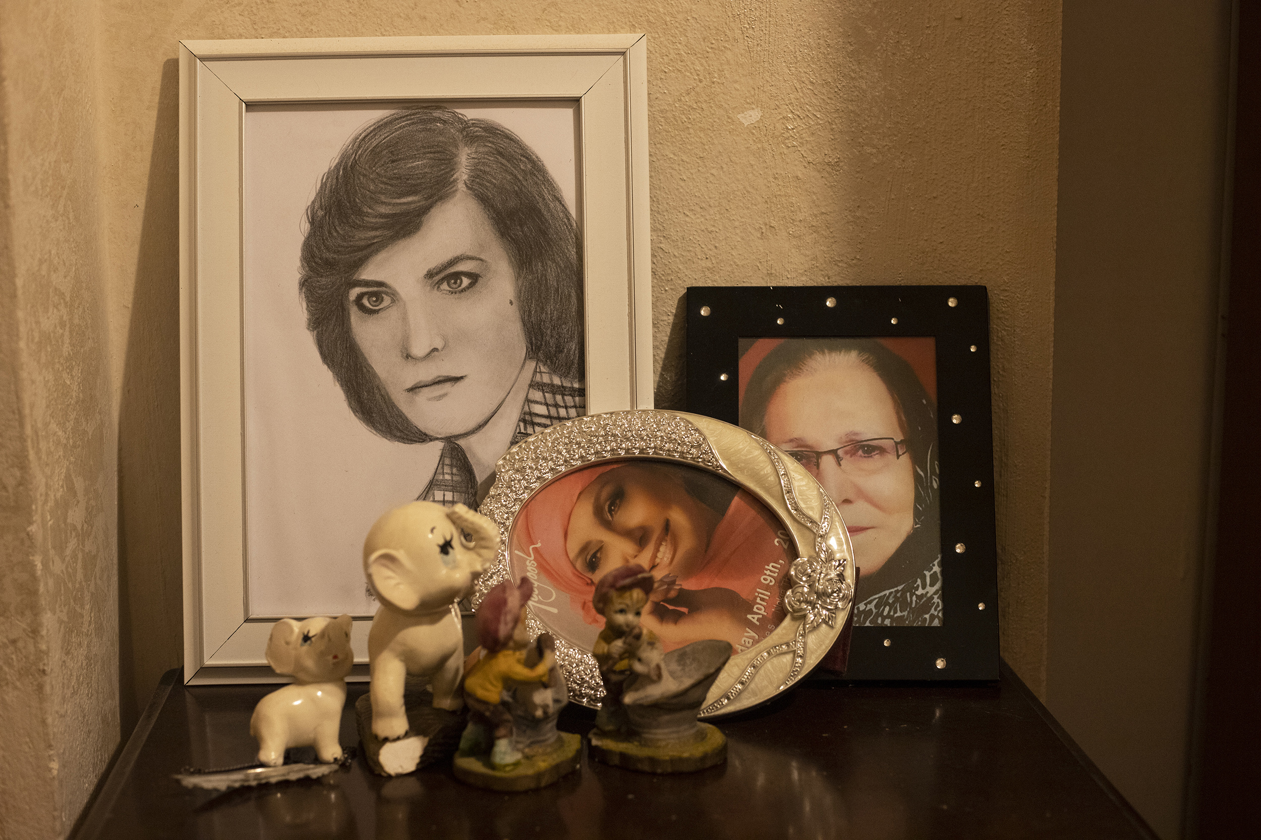 Untitled (from the series You Only Leave Once), 2021, Digital Photography. Pictures of Baran's mother and Googoosh - one of the famous singers of Iranian pop music, adorn her bedroom.