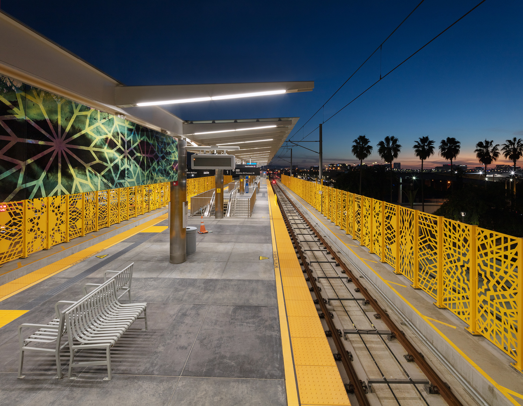 Rise, 2022, Laser cut Steel fence and Enamel murals, Public Art Commissioned by MTA Los Angeles. Aviation station, Crenshaw/LAX Line. Photo credit Panic Studio LA. Courtesy the artist.