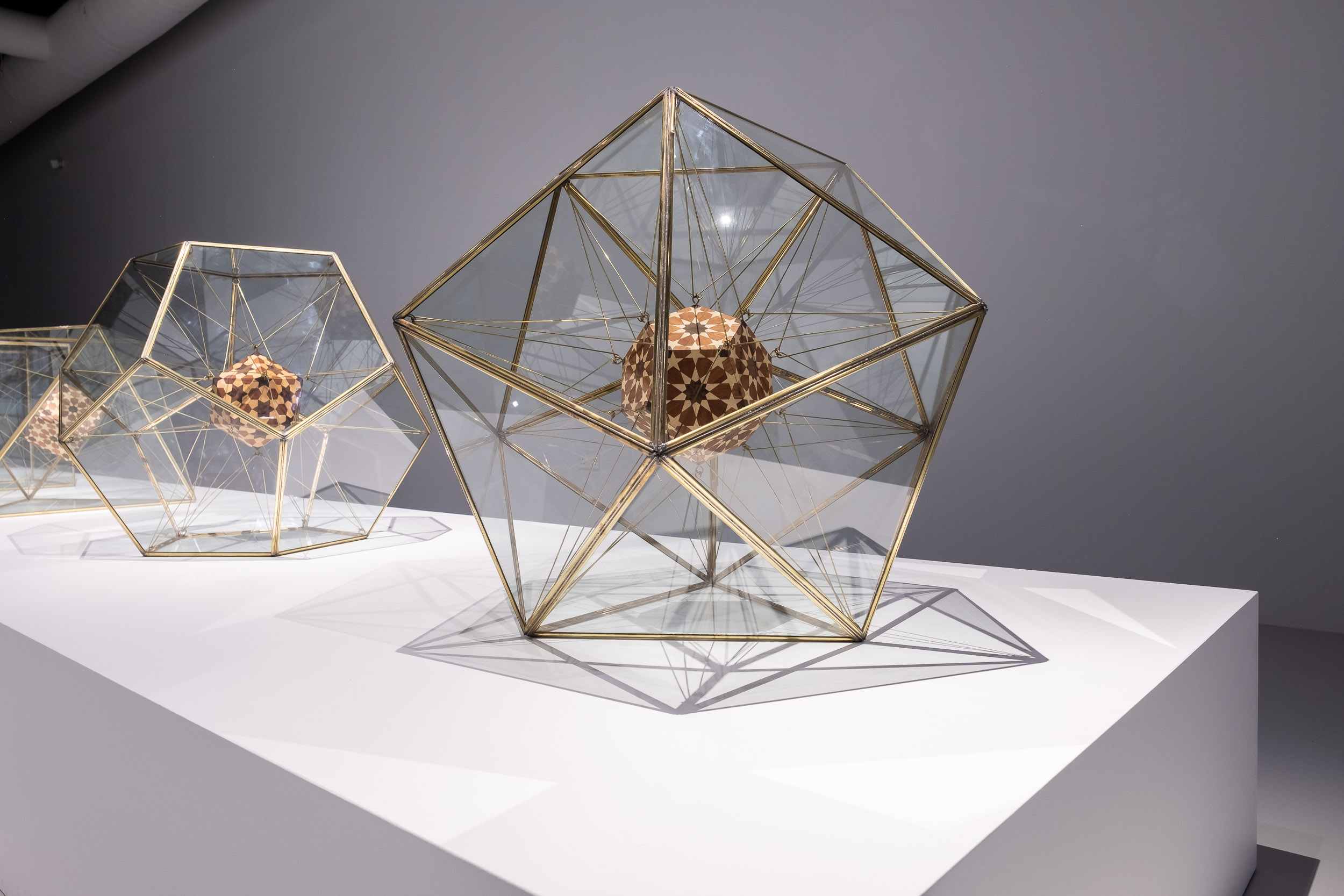 Installation shot of The Platonic Solid Duals series, 2019, Wood, copper and brass, 121 x 100.2 x 100.2 cm each. Image courtesy of Maraya Art Centre.